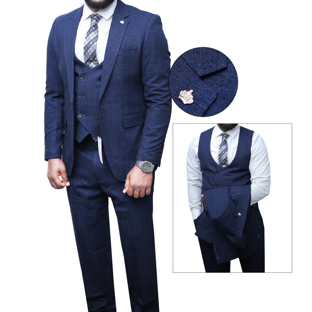 Navy blue suit with a tie and shirt